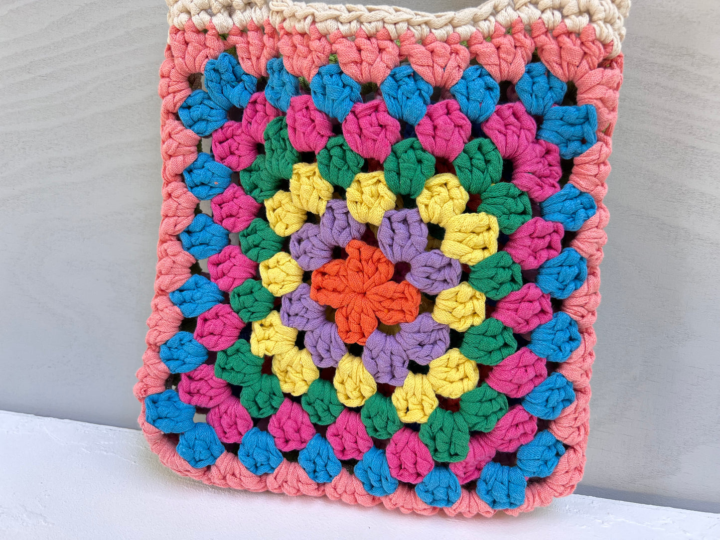 Crocheted colourful granny square tote bag