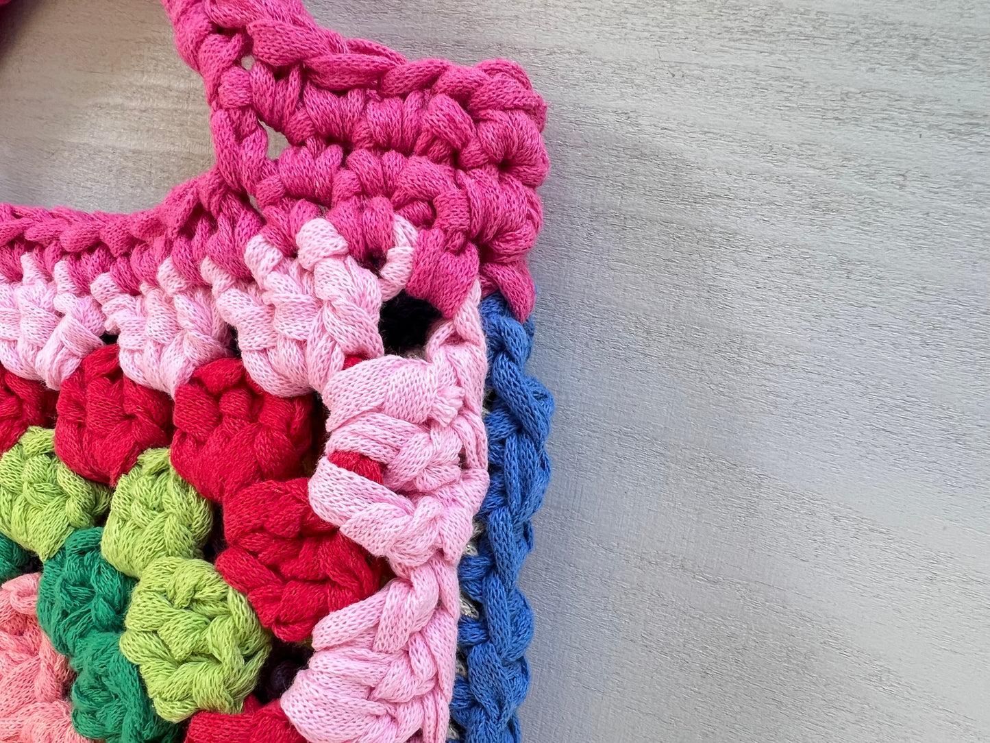 Crocheted colourful granny square tote purse