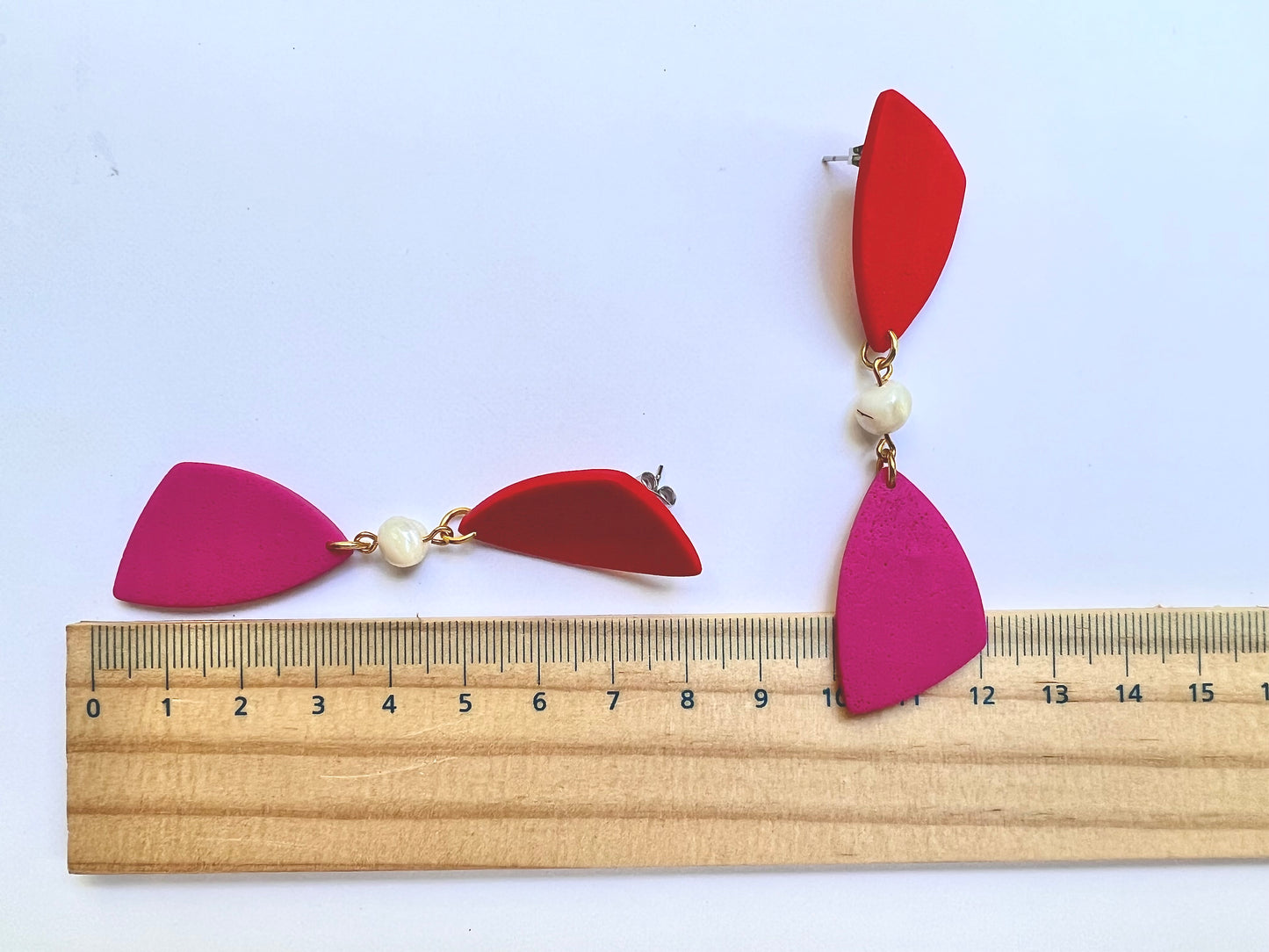 Dangle red-magenta earrings with shell bead