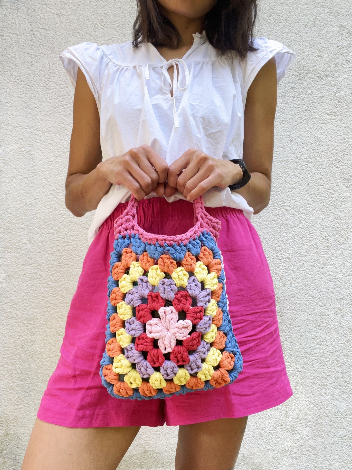 Crocheted colourful granny square tote purse