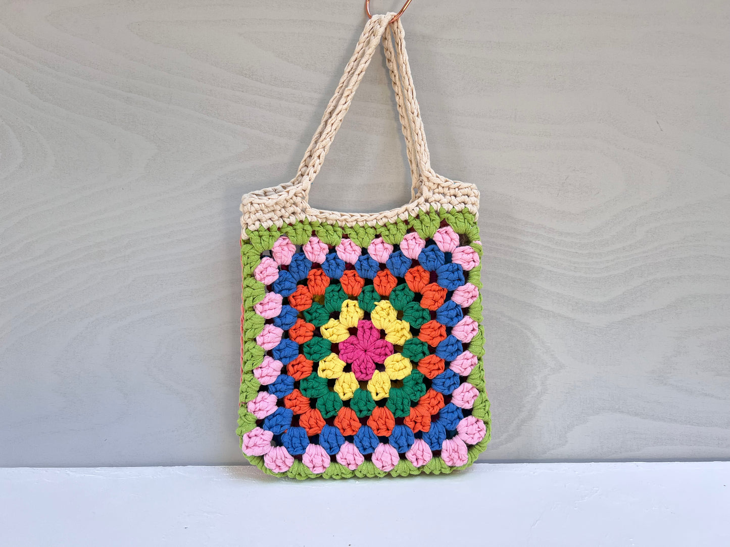 Crocheted colourful granny square tote bag