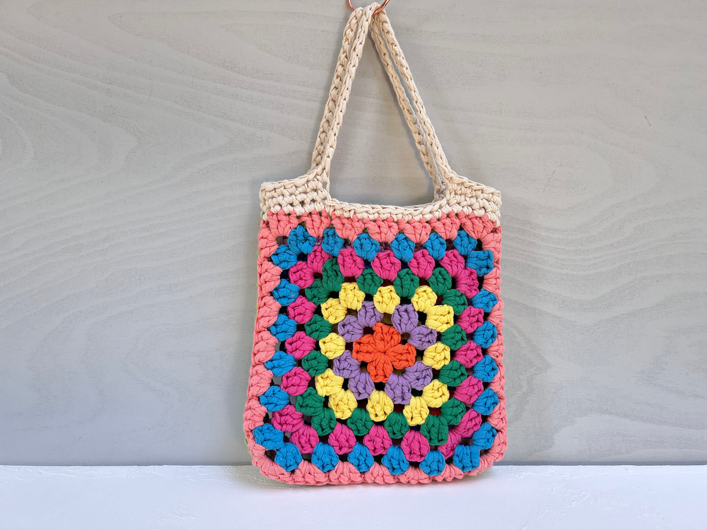 Crocheted colourful granny square tote bag