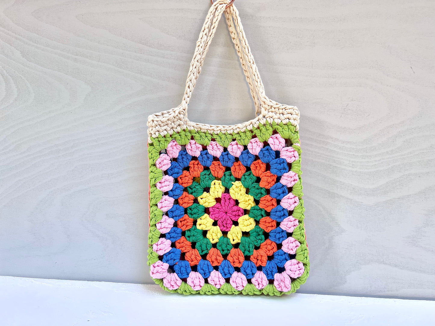 Crocheted colourful granny square tote bag