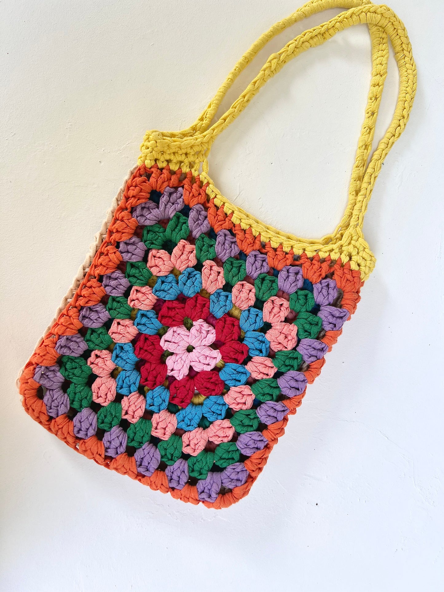 Crocheted colourful granny square tote bag