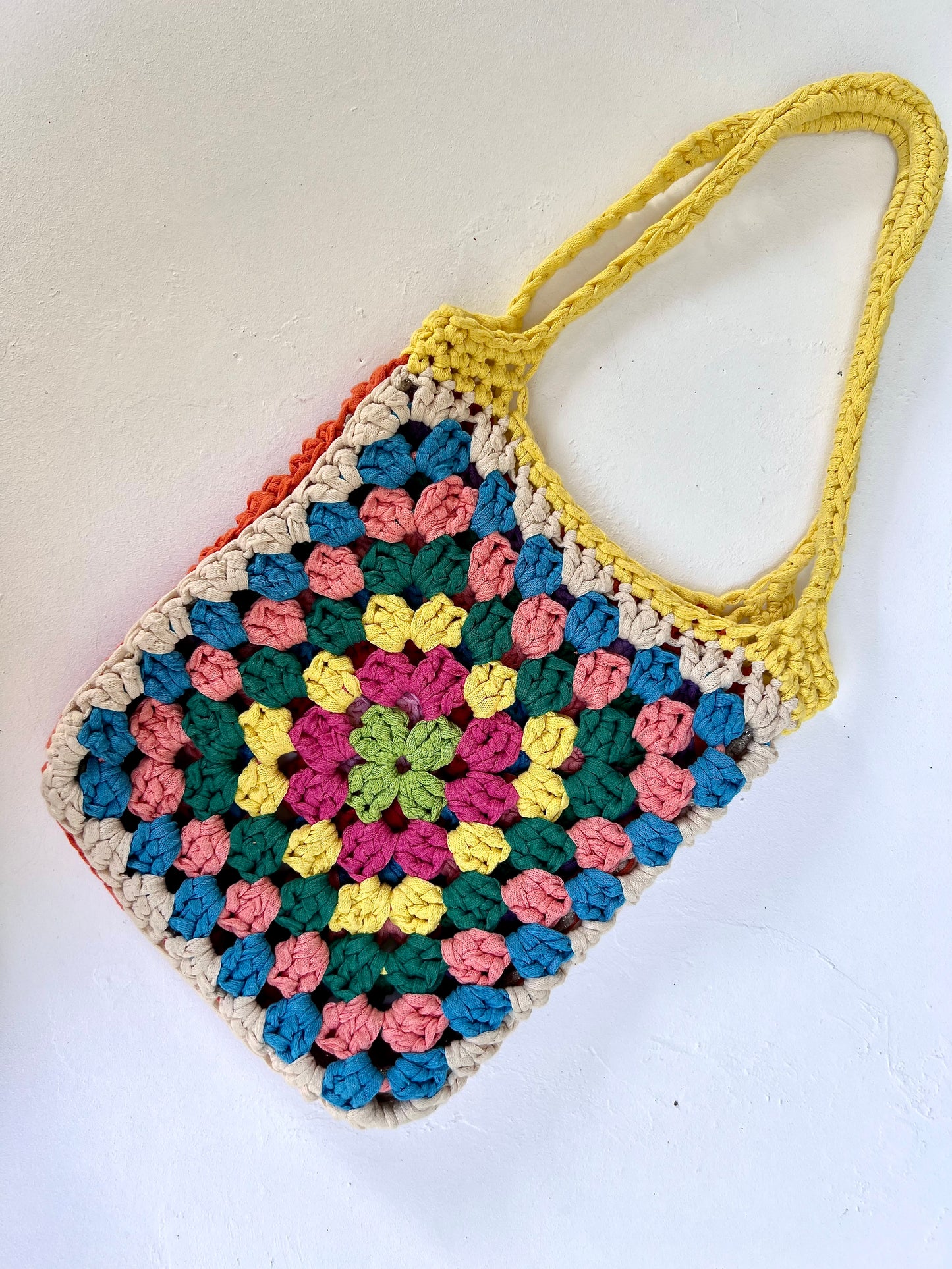 Crocheted colourful granny square tote bag