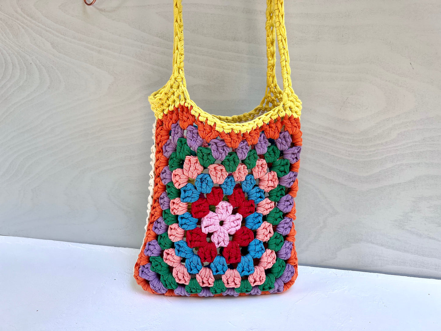 Crocheted colourful granny square tote bag