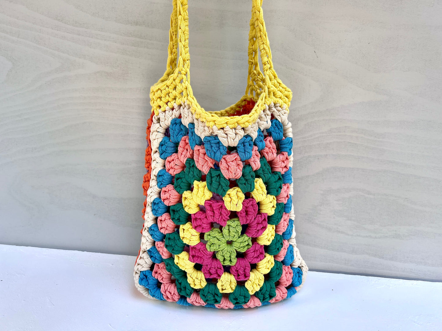 Crocheted colourful granny square tote bag